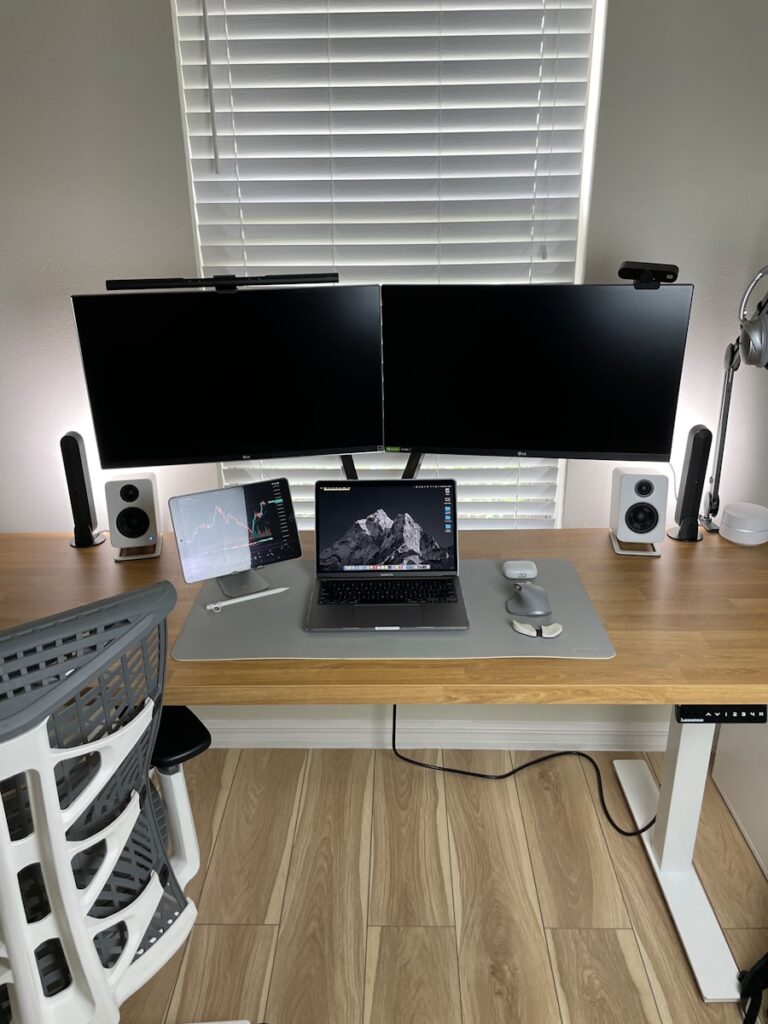 black ipad on brown wooden table